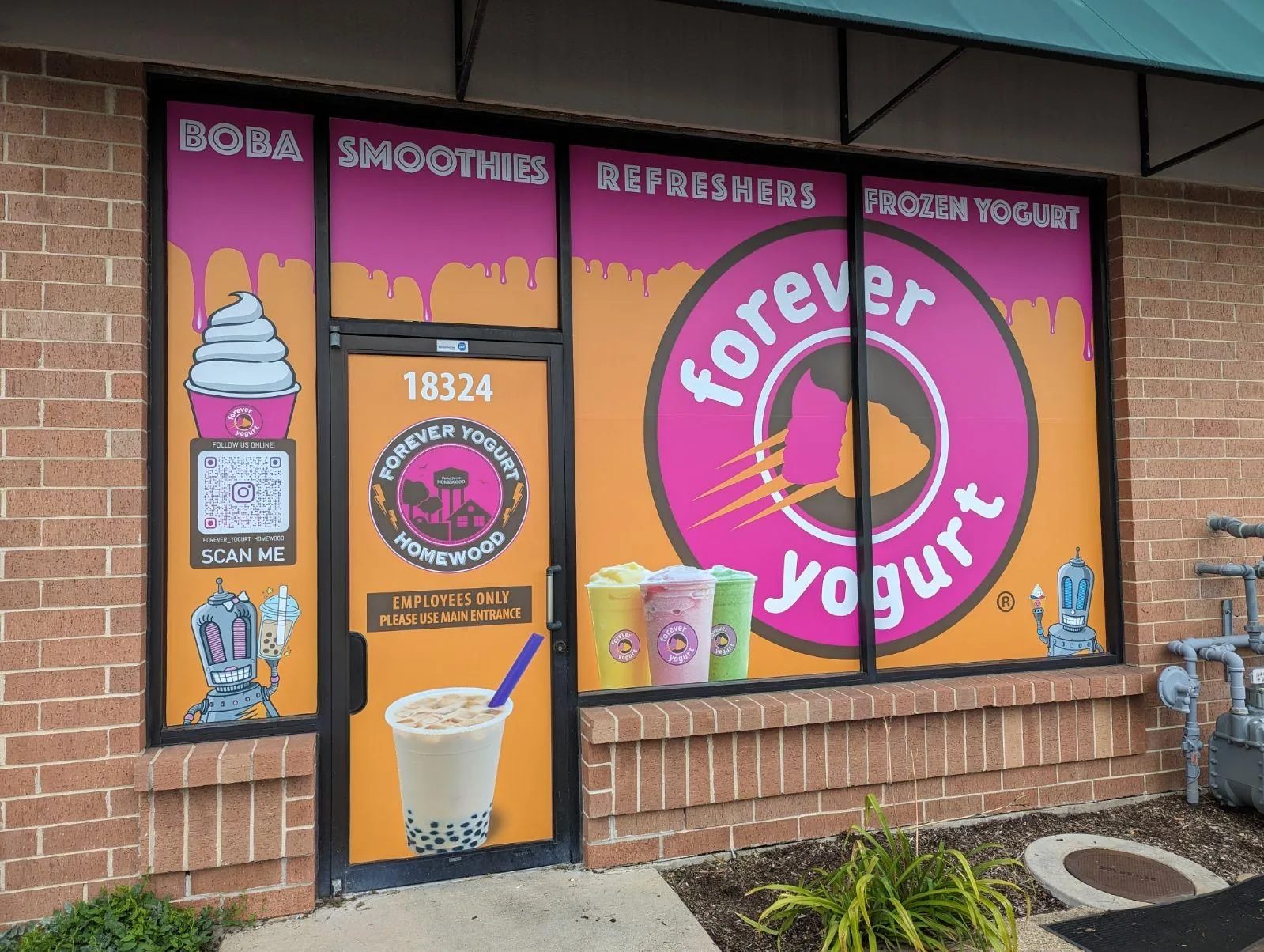Forever Yogurt storefront with full-colour printed window graphics: boba, smoothies, refreshers and frozen yogurt across every pane.